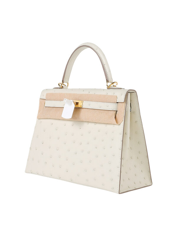 Kelly 25 Sellier in Porosus Ostrich - Vanilla Cream with Gold Hardware