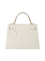 Kelly 25 Sellier in Porosus Ostrich - Vanilla Cream with Gold Hardware